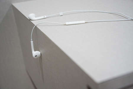 White earphone on the wooden tableの写真素材