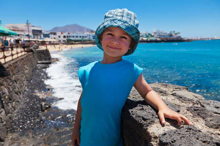 Child with sea in backgroundの写真素材