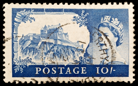 BRITAIN - CIRCA 1967: An old British ten shilling stamp showing Edinburgh Castle and portrait of Queen Elizabeth II, circa 1967 のeditorial素材