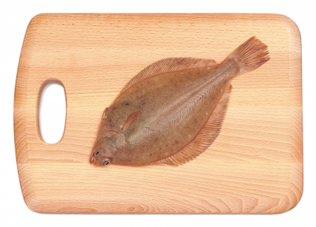 Dab Fish  Limanda limanda  on Wooden Chopping Block Boardの写真素材