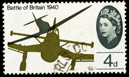 UNITED KINGDOM - CIRCA 1965: A used postage stamp printed in Britain celebrating the 25th Anniversary of the Battle of Britain showing a Supermarine Spitfire attacking a Junkers Stuka Dive Bomber, circa 1965のeditorial素材