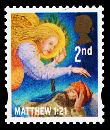 UNITED KINGDOM - CIRCA 2011: A British Used Christmas Postage Stamp showing Joseph being visited by...