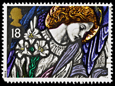UNITED KINGDOM - CIRCA 2007: A British Used Postage Stamp showing the Angel Gabriel Stained Glass Window, circa 2007のeditorial素材