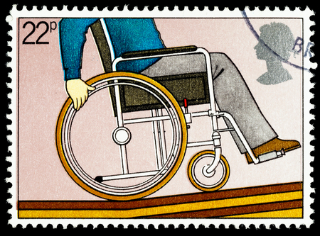 UNITED KINGDOM - CIRCA 1981: A British Used Postage Stamp Commemorating The Year of the Disabled Showing Disabled Person in a Wheelchairのeditorial素材