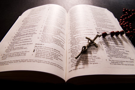 Rosary and cross on the Holy Bible