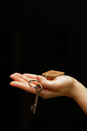 Hand holding key 