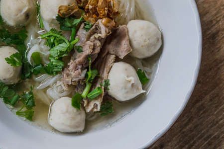 Pork noodle in white bowlの写真素材