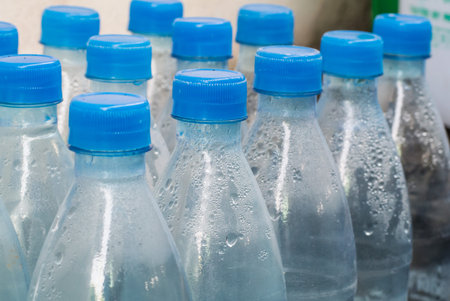 Clear plastic bottles with blue caps