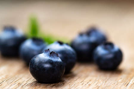Blueberries on wooden floor close upの写真素材