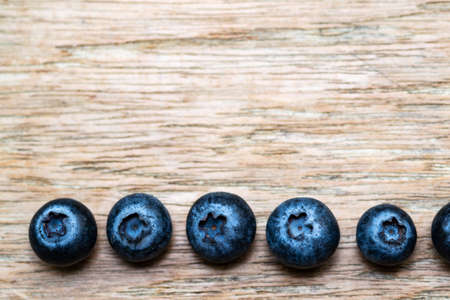 Blueberries on wooden floor close upの写真素材