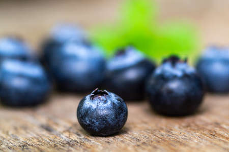 Blueberries on wooden floor close upの写真素材