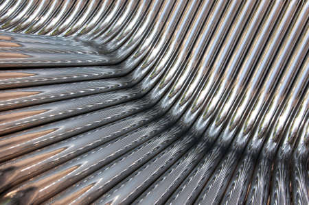 Twisted chrome pipes abstract pattern backgroundの写真素材