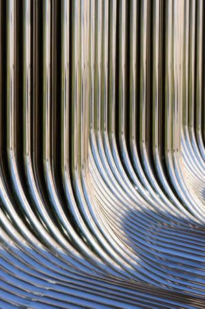Twisted chrome pipes abstract pattern backgroundの写真素材