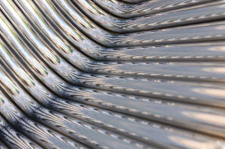Twisted chrome pipes abstract pattern backgroundの写真素材