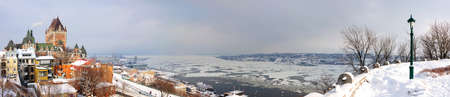 Quebec City skyline panorama with Chateau Frontenac viewed from hill during winter timeの写真素材