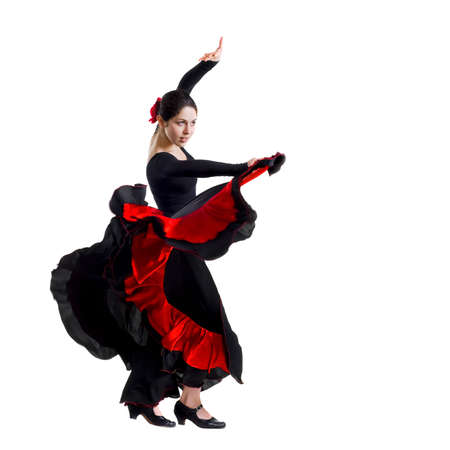 Portrait of  beautiful young woman dancing flamenco isolated on whiteの写真素材