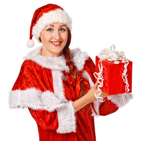 Christmas girl holding gift wearing Santa costume  Isolated over white background の写真素材