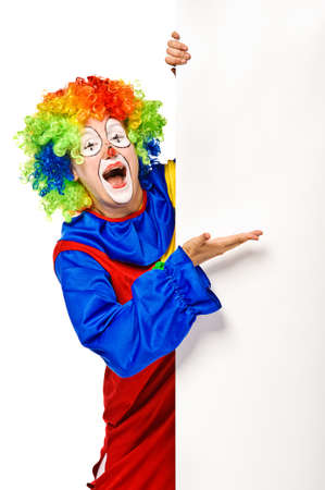 Happy clown holding the blank board  Isolatedの写真素材