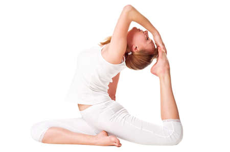 Young woman doing yoga exercise  Isolated over whiteの写真素材