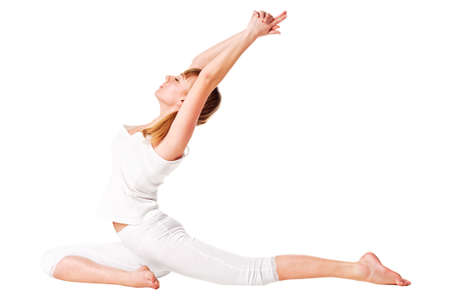 Young woman doing yoga exercise  Isolated over whiteの写真素材