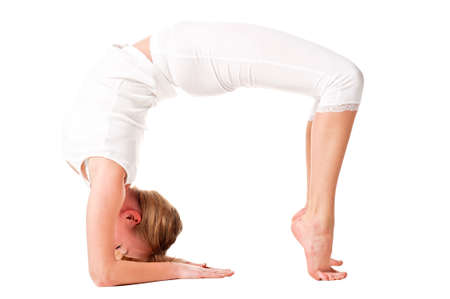Young woman doing yoga exercise  Isolated over whiteの写真素材