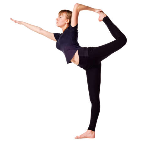 Beautiful young woman doing yoga exercise  isolated の写真素材