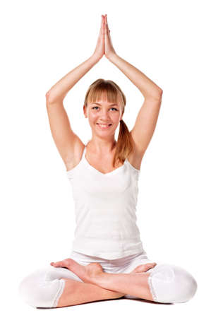 Young woman doing yoga exercise  Isolated over whiteの写真素材