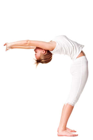 Young woman doing yoga exercise. Isolated over whiteの写真素材