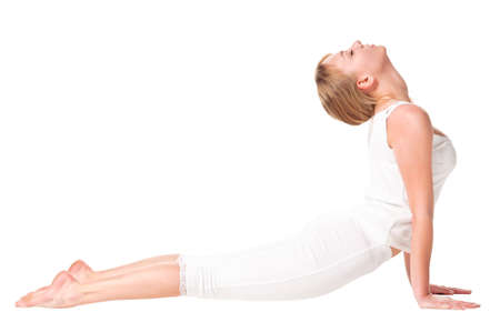 Young woman doing yoga exercise. Isolated over whiteの写真素材