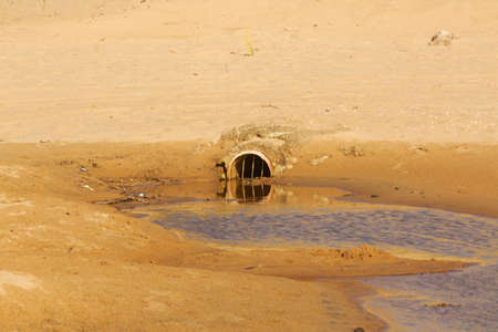 sewer on beachの写真素材