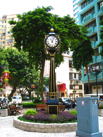 08/09/2008, Macao, China - A tall and slim black Western grandfather clock in the town centre displaying the time to the general publicのeditorial素材