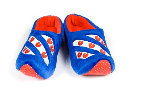pair of blue house slippers isolatedの写真素材