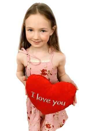 nice little girl with soft heart toy isolated on white の写真素材