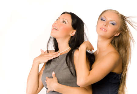 embracing girlfriends isolated on whiteの写真素材