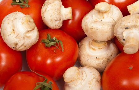 tomato and champignon mushroom backgroundの写真素材
