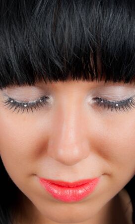young female with closed eyesの写真素材