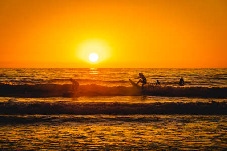 Orange Sunset Surfersの写真素材
