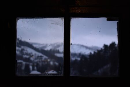 View of mountain landscape from window inside Brans castle in Branの写真素材