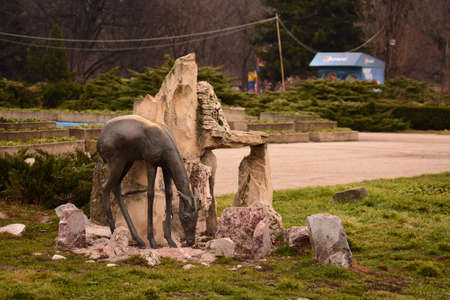 Stone statue of an animal eating in King Michael i park in Bucharestのeditorial素材