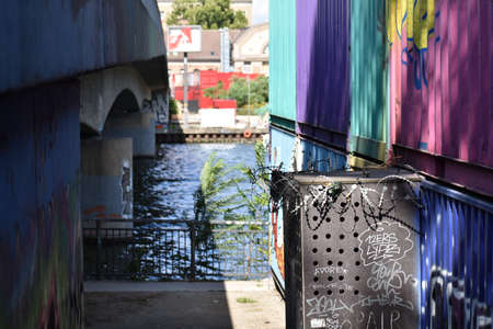River view between painted metal shipping containers in Friedrichshain Berlinのeditorial素材
