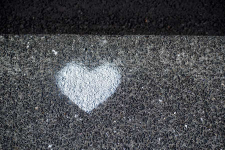Landscape of white heart painted on concrete ground in Keflavikの写真素材