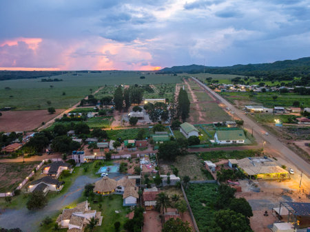 Aerial landscape of rainforest and village during summer sunset in Nobres Bom Jardim Mato Grosso Brazilのeditorial素材