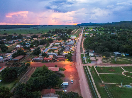 Aerial landscape of rainforest and village during summer sunset in Nobres Bom Jardim Mato Grosso Brazilのeditorial素材