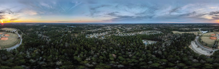Aerial sunset landscape of forest and suburban neighborhood in Grovetown Augusta Georgia USA