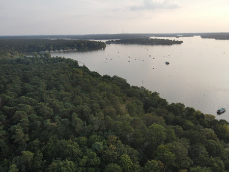 Aerial landscape of island in river and Grunewald forest on a sunny summer day in Berlin Germanyの写真素材