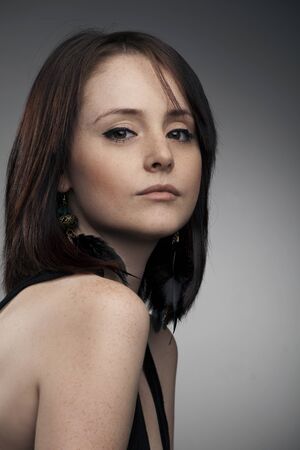 portrait of a beautiful woman on a dark backgroundの写真素材