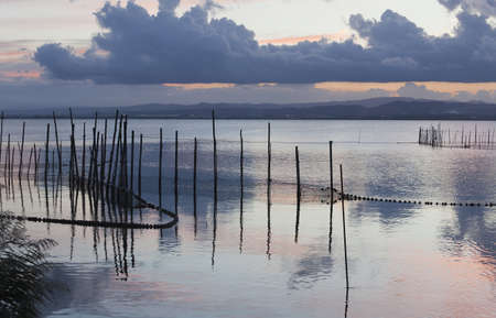 fishing nets in the lagoon at sunset Valenciaの写真素材