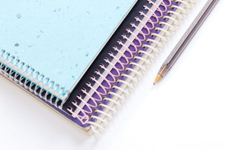 spiral notebooks and pen