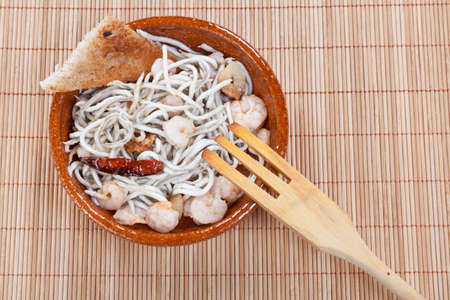 eel stew with garlic and chilli with prawnsの写真素材