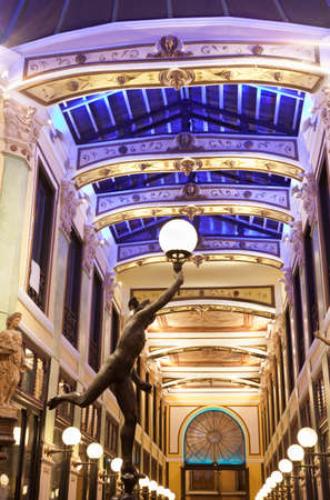 Valladolid,  Spain, September 30, 2011.Shopping mall "Pasaje Gutierrez" and statue of Mercury Ortz architect Jerome de Urbina, on the night. Nineteenth century, is now a shopping arcadeのeditorial素材